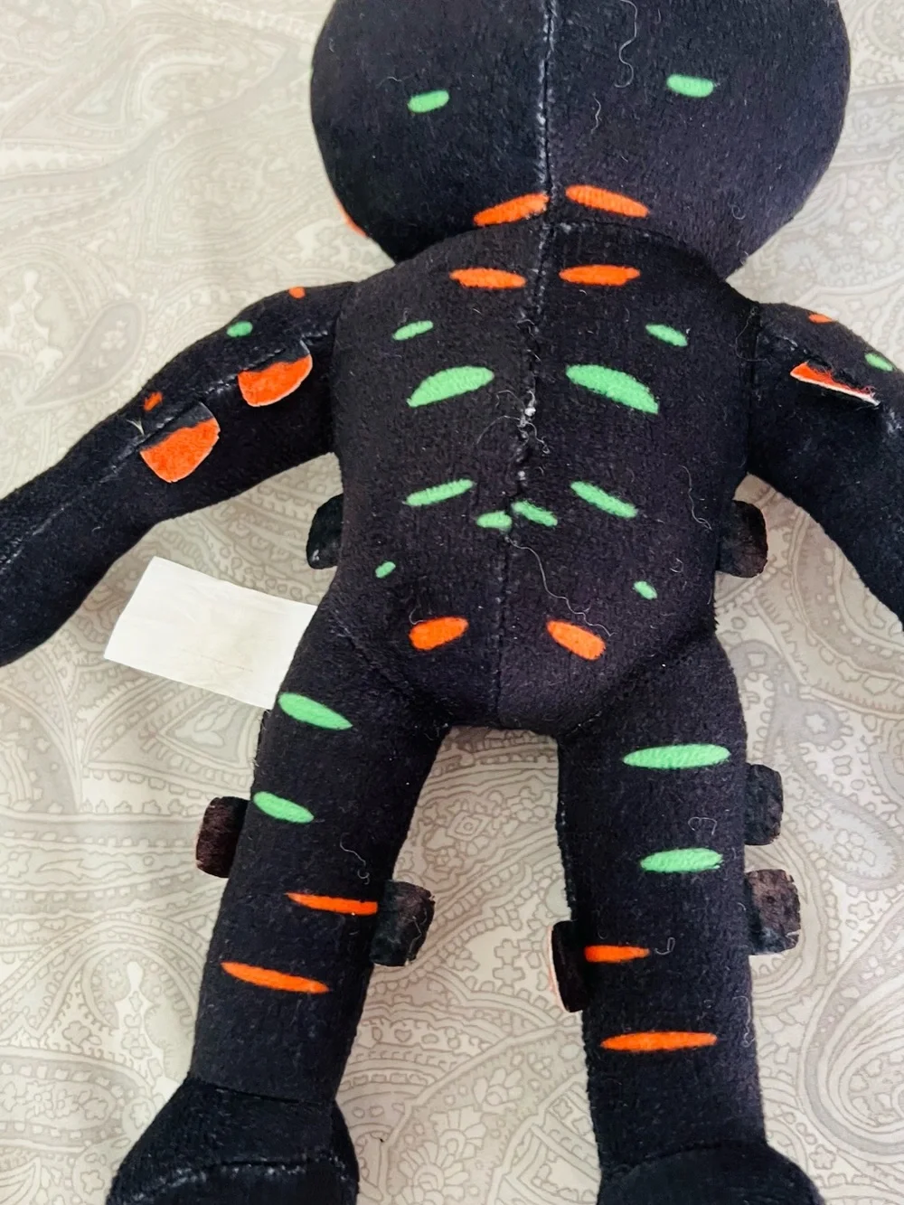 Star Wars plushie & Black Plush Toy with Neon Green & Orange Accents